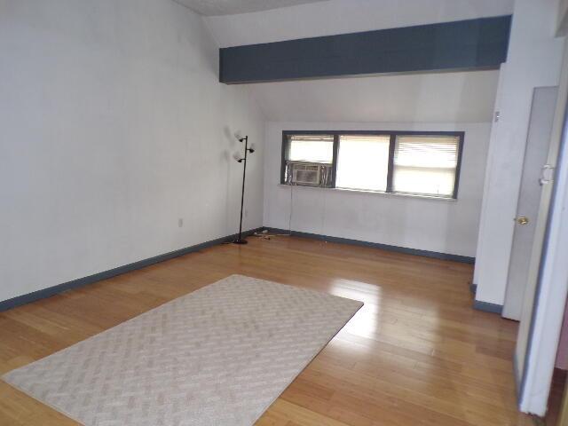 1292 Brentwood Dr, East Stroudsburg, PA 18301 - unfurnished room featuring cooling unit, wood finished floors, and baseboards