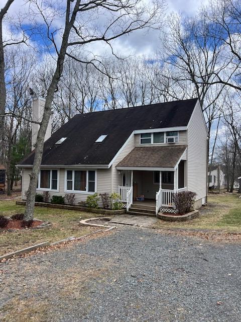 1292 Brentwood Dr, East Stroudsburg, PA 18301 - view of front of house featuring a porch and gravel driveway
