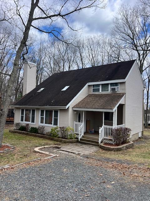 1292 Brentwood Dr, East Stroudsburg, PA 18301 - view of front of property featuring a chimney, a porch, and roof with shingles