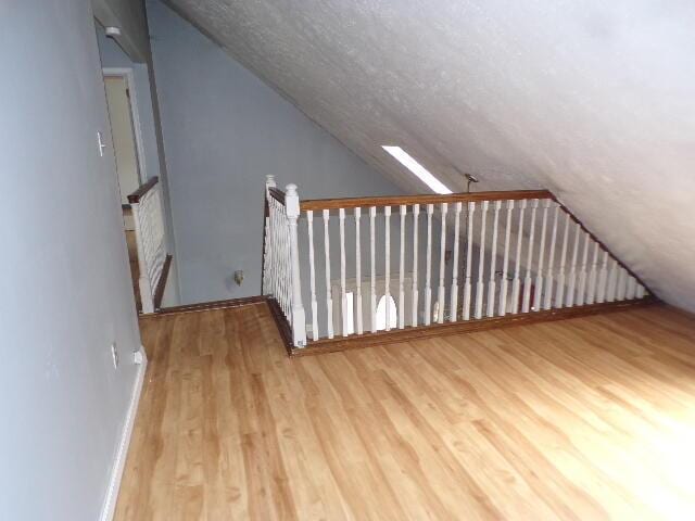 1292 Brentwood Dr, East Stroudsburg, PA 18301 - additional living space with vaulted ceiling and wood finished floors