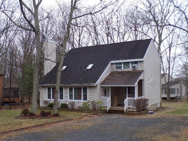 1292 Brentwood Dr, East Stroudsburg, PA 18301 - view of front of home featuring covered porch and a chimney