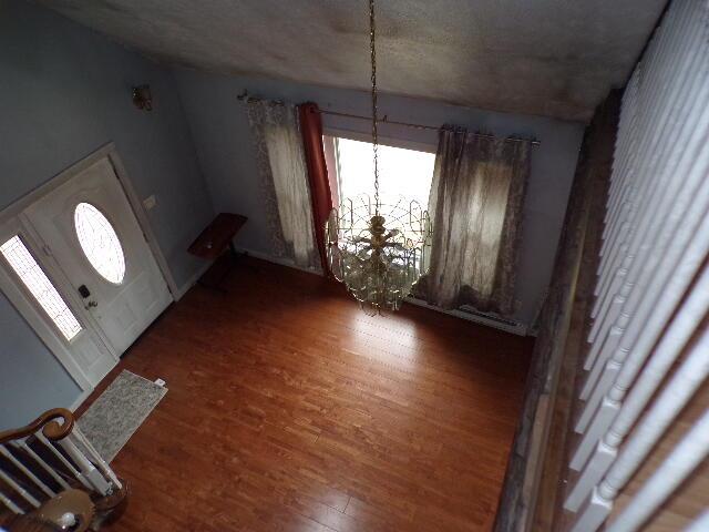 1292 Brentwood Dr, East Stroudsburg, PA 18301 - entryway featuring wood finished floors and a chandelier