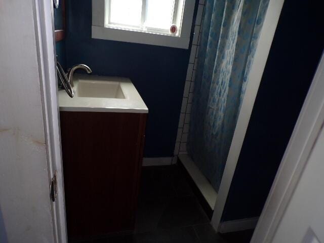 1292 Brentwood Dr, East Stroudsburg, PA 18301 - bathroom featuring a shower with curtain, vanity, and tile patterned flooring