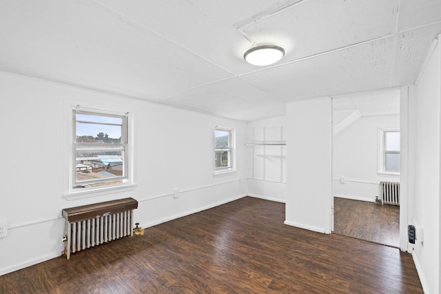 104 Serling St, Dupont, PA 18641 - spare room with radiator heating unit, wood finished floors, and plenty of natural light