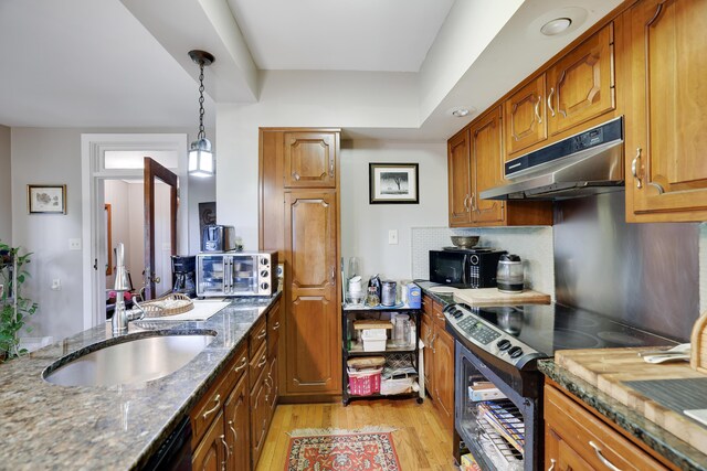 5245 Glenbrook Rd, Stroudsburg, PA 18360 - kitchen with black appliances, under cabinet range hood, a sink, light wood-style floors, and stone countertops