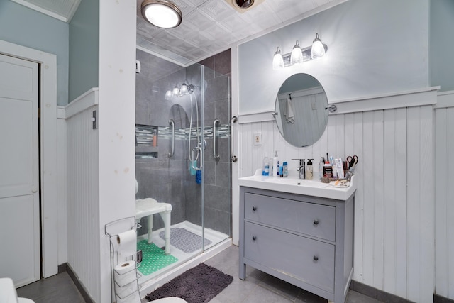 5245 Glenbrook Rd, Stroudsburg, PA 18360 - bathroom with a shower stall, vanity, wainscoting, and tile patterned flooring