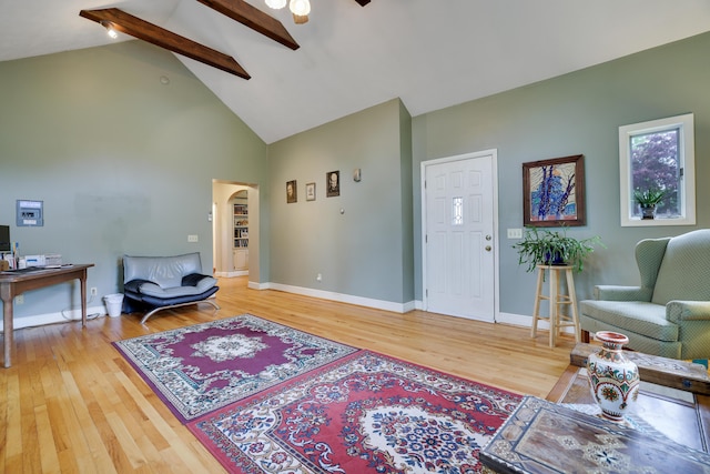 5245 Glenbrook Rd, Stroudsburg, PA 18360 - living area with light wood finished floors, high vaulted ceiling, beam ceiling, arched walkways, and baseboards