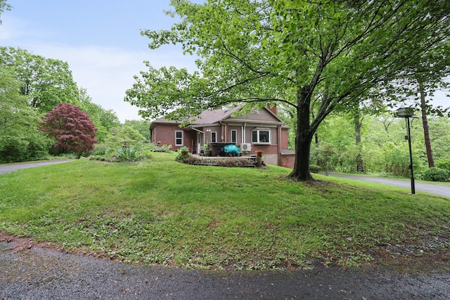 5245 Glenbrook Rd, Stroudsburg, PA 18360 - view of front facade featuring brick siding and a front yard