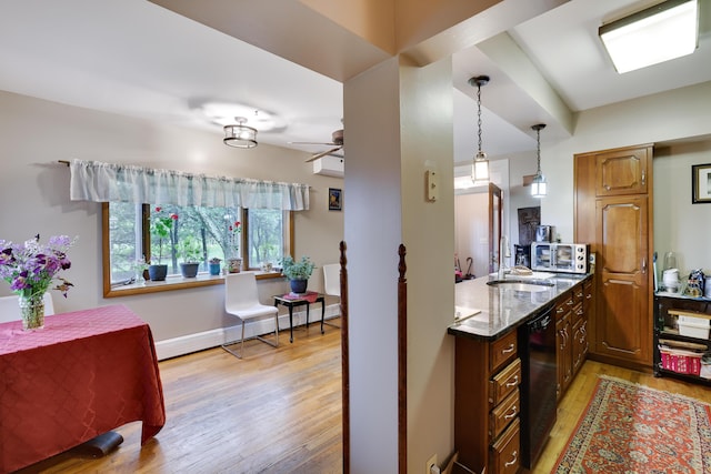 5245 Glenbrook Rd, Stroudsburg, PA 18360 - kitchen featuring a sink, light wood-style floors, dishwasher, pendant lighting, and dark stone counters