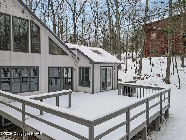 view of snow covered deck