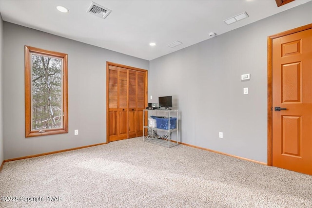 unfurnished bedroom featuring a closet and carpet