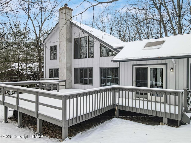 view of snow covered deck