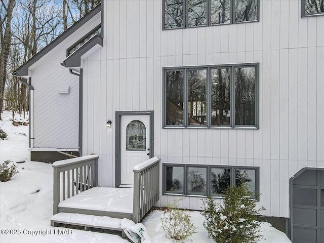 view of snow covered property entrance