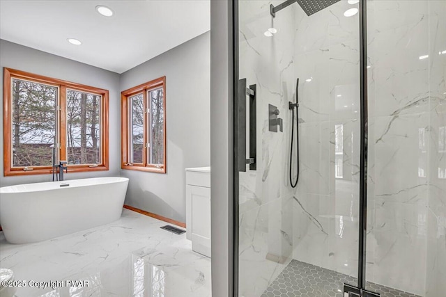 bathroom featuring separate shower and tub