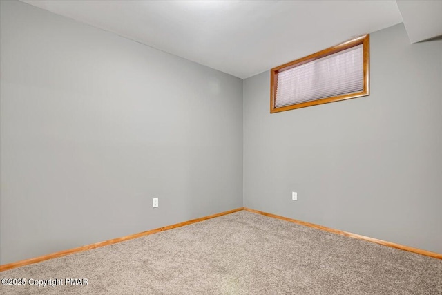 unfurnished room featuring carpet flooring