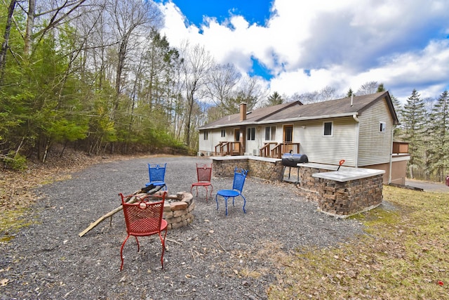 982 Long Ridge Rd, Hawley, PA 18428 - back of house featuring an outdoor fire pit