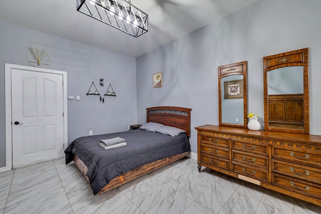 982 Long Ridge Rd, Hawley, PA 18428 - bedroom with marble finish floor and an inviting chandelier