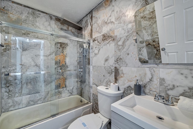 982 Long Ridge Rd, Hawley, PA 18428 - full bath featuring vanity, toilet, bath / shower combo with glass door, a textured ceiling, and backsplash