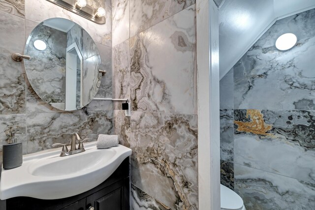 982 Long Ridge Rd, Hawley, PA 18428 - bathroom with tile walls, toilet, and vanity