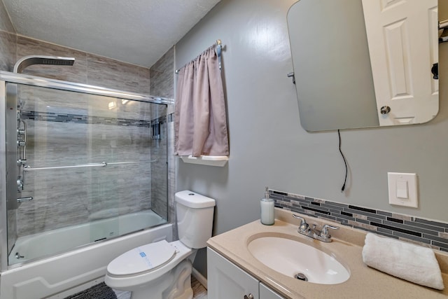 982 Long Ridge Rd, Hawley, PA 18428 - full bathroom featuring a textured ceiling, toilet, vanity, tasteful backsplash, and shower / bath combination with glass door