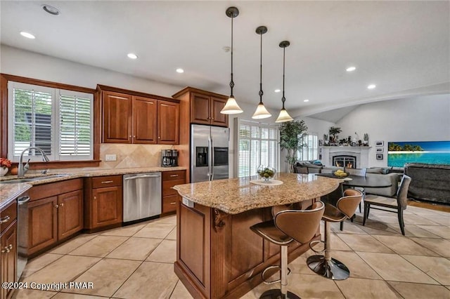 187 Eisenhart Blvd, Bangor, PA 18013 - kitchen with appliances with stainless steel finishes, a sink, a center island, light tile patterned flooring, and tasteful backsplash