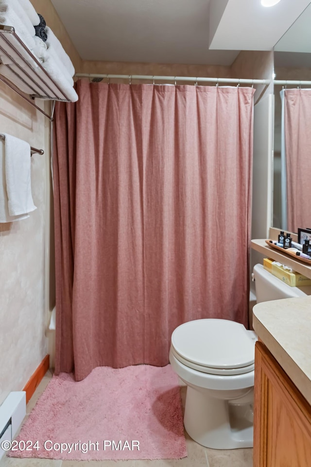 bathroom with tile patterned flooring, a shower with curtain, vanity, and toilet