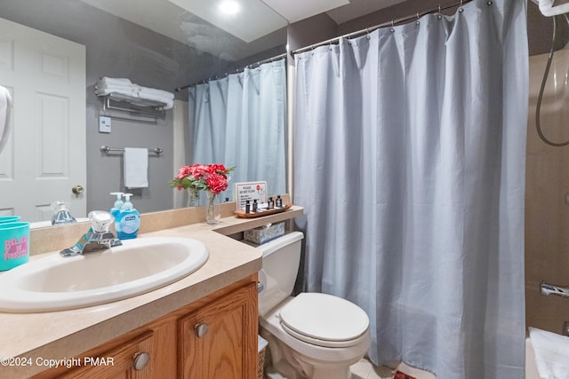 full bathroom with vanity, toilet, and a shower with curtain