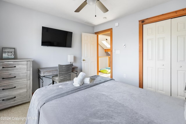 bedroom with a ceiling fan and a closet