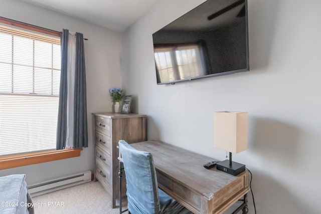 office area with baseboard heating, a wealth of natural light, and light colored carpet