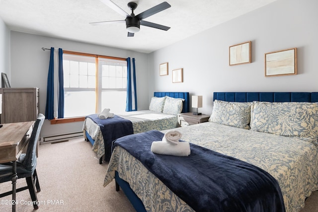 bedroom with ceiling fan, baseboard heating, carpet, and a textured ceiling