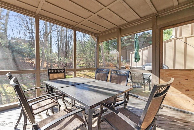 sunroom / solarium featuring coffered ceiling