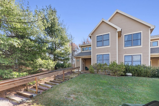 view of front of home with a front lawn