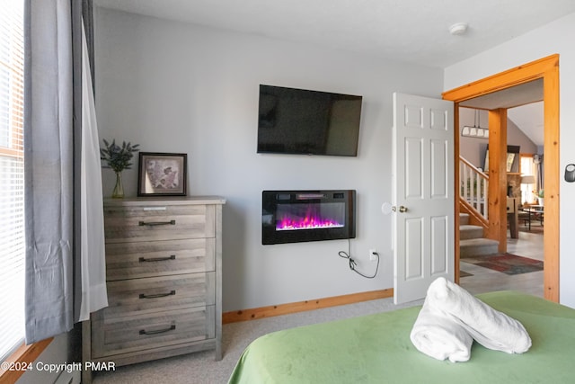 bedroom featuring carpet flooring and baseboards