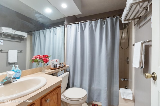 full bathroom with toilet, a shower with curtain, and vanity