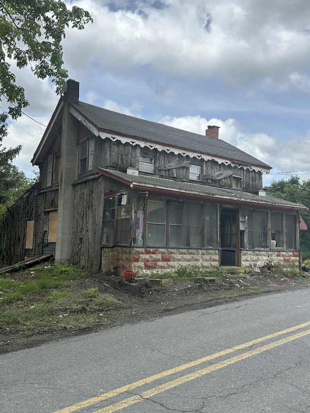 55 Mill Rd, Palmerton, PA 18071 - view of front facade with a sunroom, a chimney, and stone siding