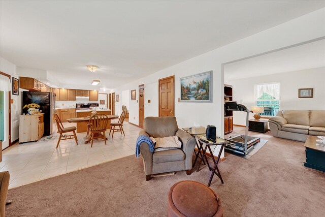 146 Bernadette Dr, Dingmans Ferry, PA 18328 - living room with light colored carpet and light tile patterned flooring