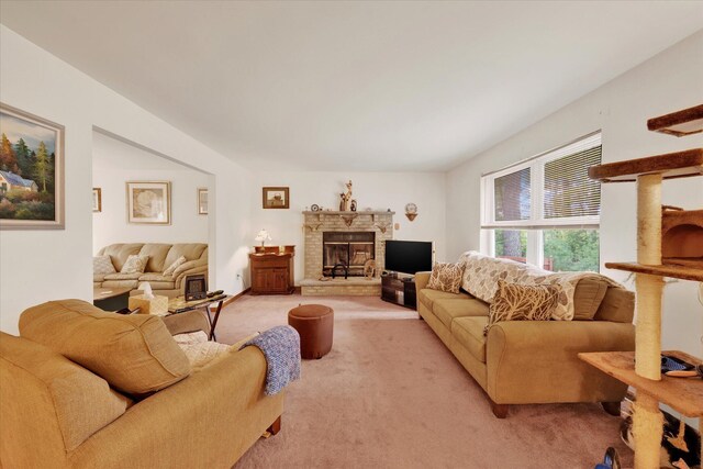 146 Bernadette Dr, Dingmans Ferry, PA 18328 - living room featuring light carpet and a stone fireplace