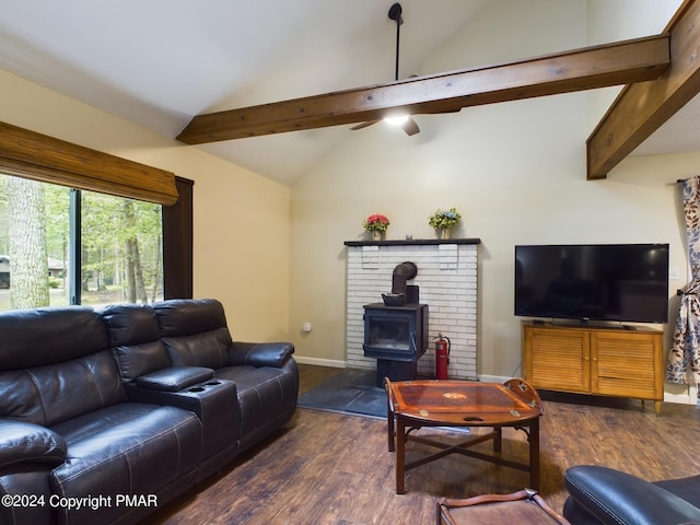 living room with vaulted ceiling with beams, dark wood finished floors, a wood stove, and baseboards