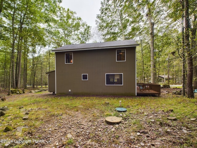 view of property exterior featuring a deck