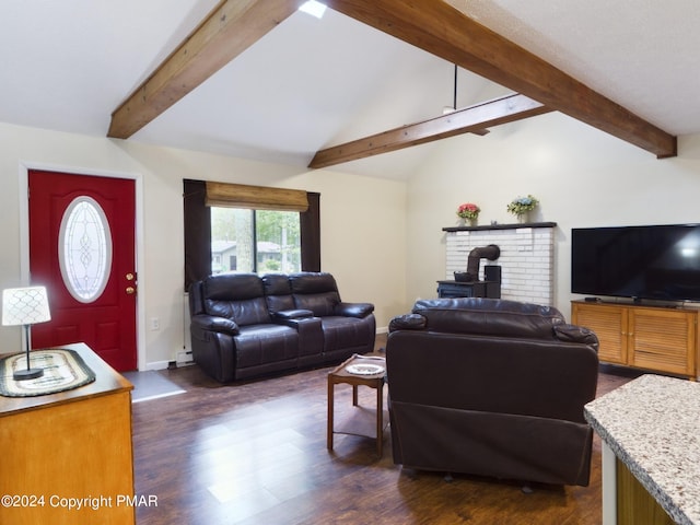 living area featuring lofted ceiling with beams, dark wood-style flooring, a wood stove, and baseboards