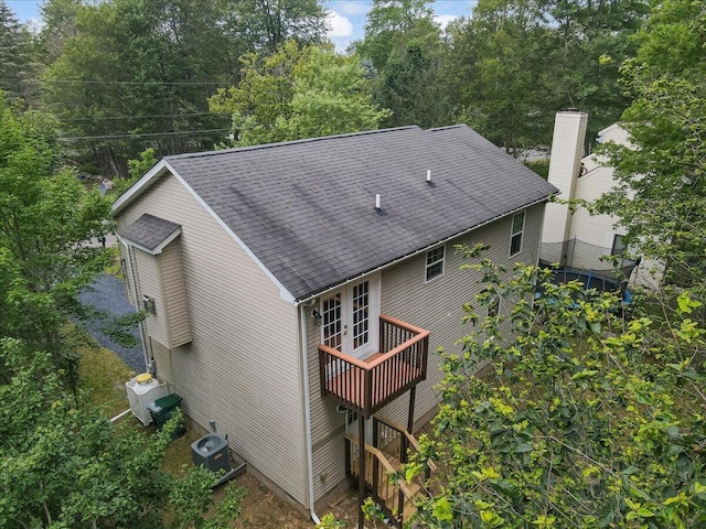 4580 Briarcliff Ter, Tobyhanna, PA 18466 - rear view of house with roof with shingles, french doors, and a wooden deck