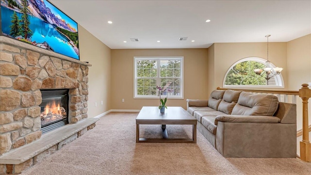 4580 Briarcliff Ter, Tobyhanna, PA 18466 - living area featuring carpet, a stone fireplace, recessed lighting, and a chandelier