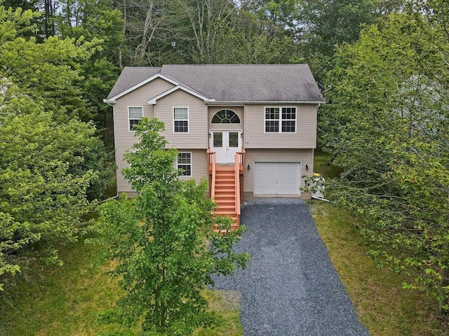 4580 Briarcliff Ter, Tobyhanna, PA 18466 - raised ranch with asphalt driveway, a garage, stairs, and roof with shingles