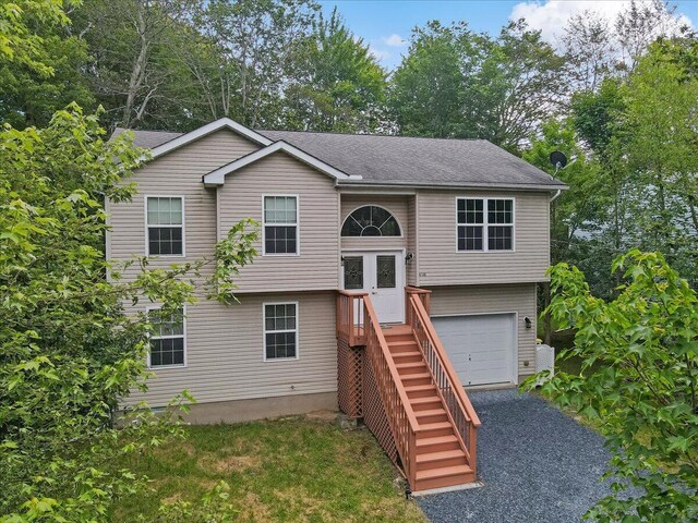 4580 Briarcliff Ter, Tobyhanna, PA 18466 - split foyer home with a garage and a shingled roof
