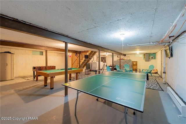 playroom with concrete flooring, pool table, and a baseboard radiator