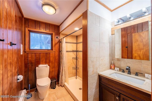 bathroom with ornamental molding, tile walls, curtained shower, and toilet