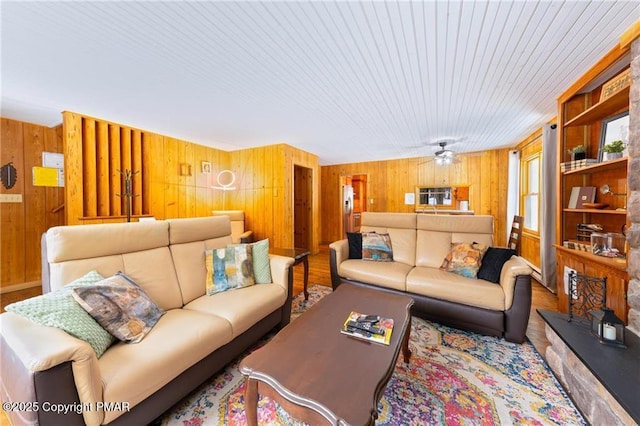 living room featuring wooden walls