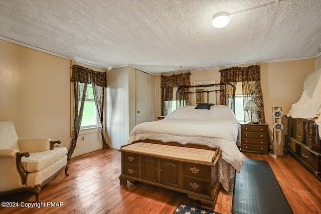 7714 Cherry Valley Rd, Delaware Water Gap, PA 18327 - bedroom featuring a textured ceiling, ornamental molding, and wood-type flooring
