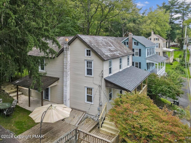 7714 Cherry Valley Rd, Delaware Water Gap, PA 18327 - back of property featuring roof with shingles and a wooden deck