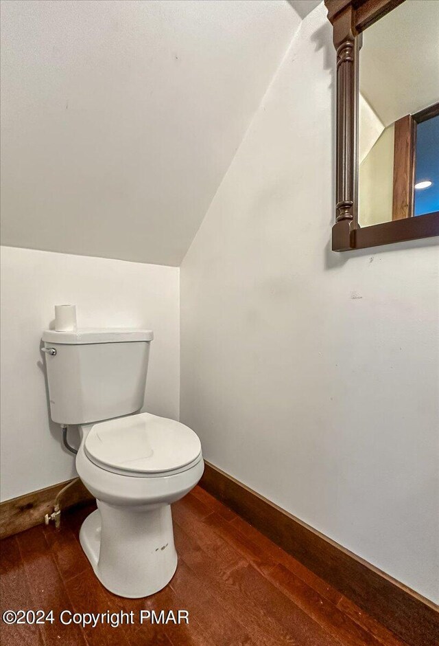7714 Cherry Valley Rd, Delaware Water Gap, PA 18327 - half bath with lofted ceiling, baseboards, toilet, and wood finished floors